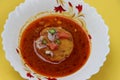 Kat vada, Kat wada or Batata vada sambar or Vada usal, spicy and tasty snack,ÃÂ vada or potato patties served in curry